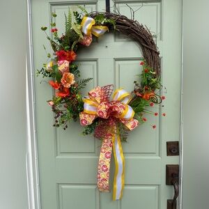 Vibrant Floral Holiday Wreath with Yellow and Red Accents